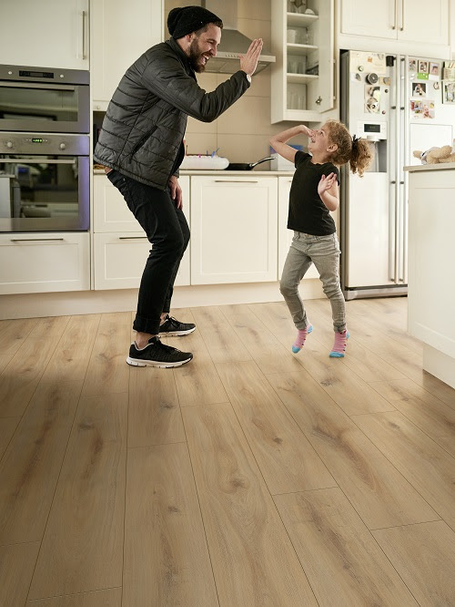 Shot of a little girl giving her father a high five